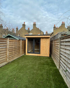 Example of a garden office with storage shed by Hargreaves Garden Spaces